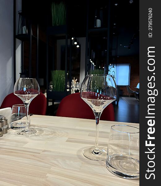 Empty Wine Glasses And Glasses On A Wooden Table