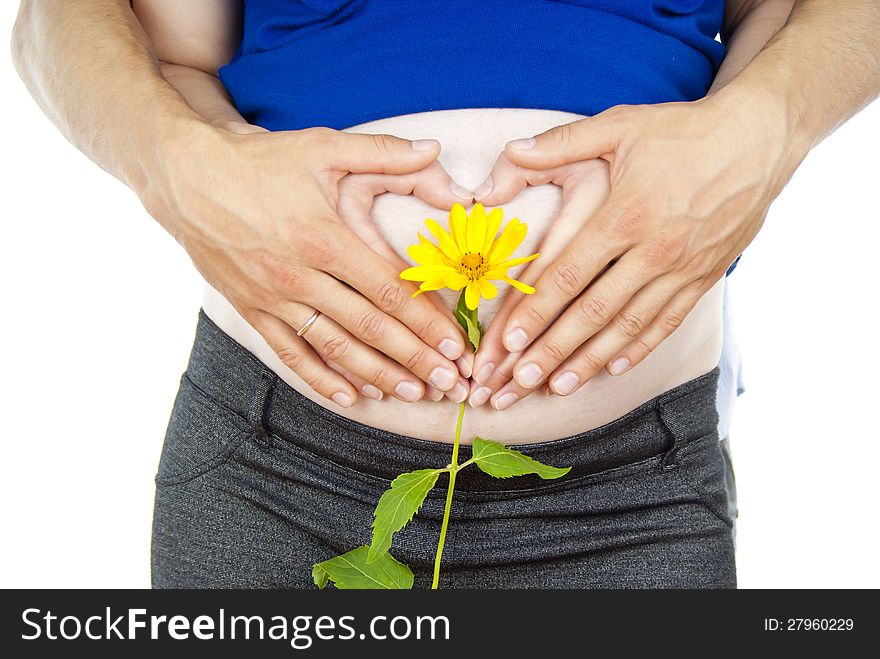 Abdomen of pregnant girl and flowers
