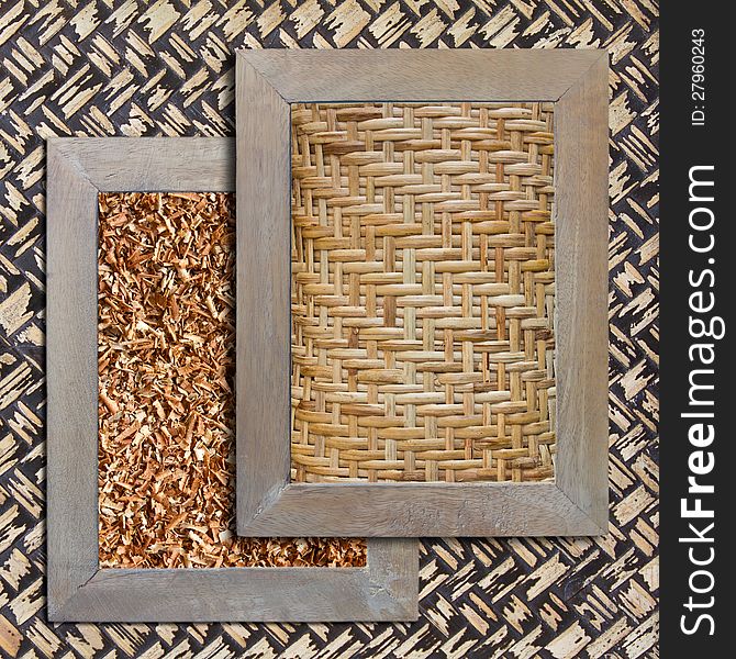 Woven with bamboo sawdust in wooden frames on a bamboo background. Woven with bamboo sawdust in wooden frames on a bamboo background.