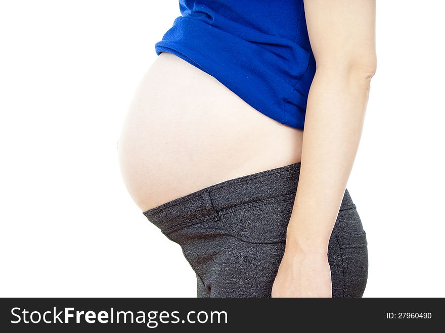 Detail of the abdomen of pregnant woman isolated on white background