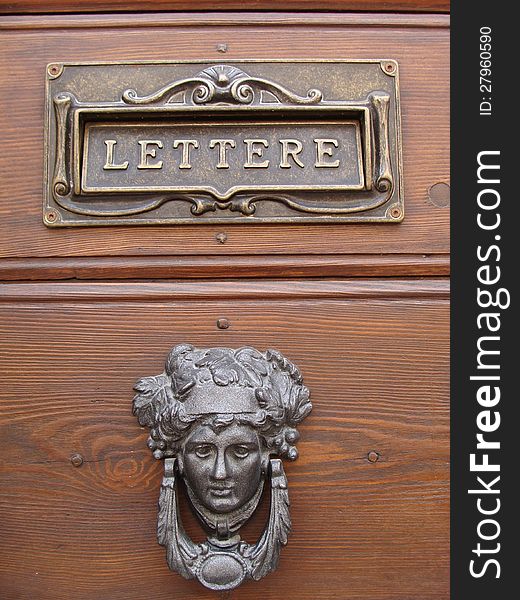 Wooden door with metal ornaments