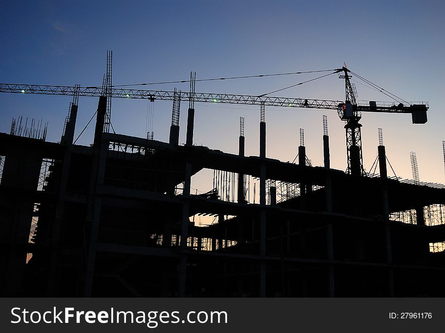 Silhouette of construction site on sunset time