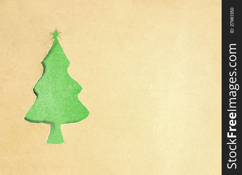 Torn paper christmas tree on green background. Torn paper christmas tree on green background