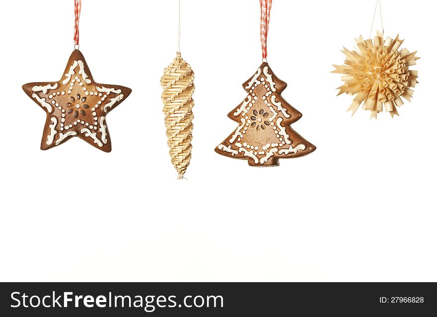 Ginger and wood Christmas decorations on white background