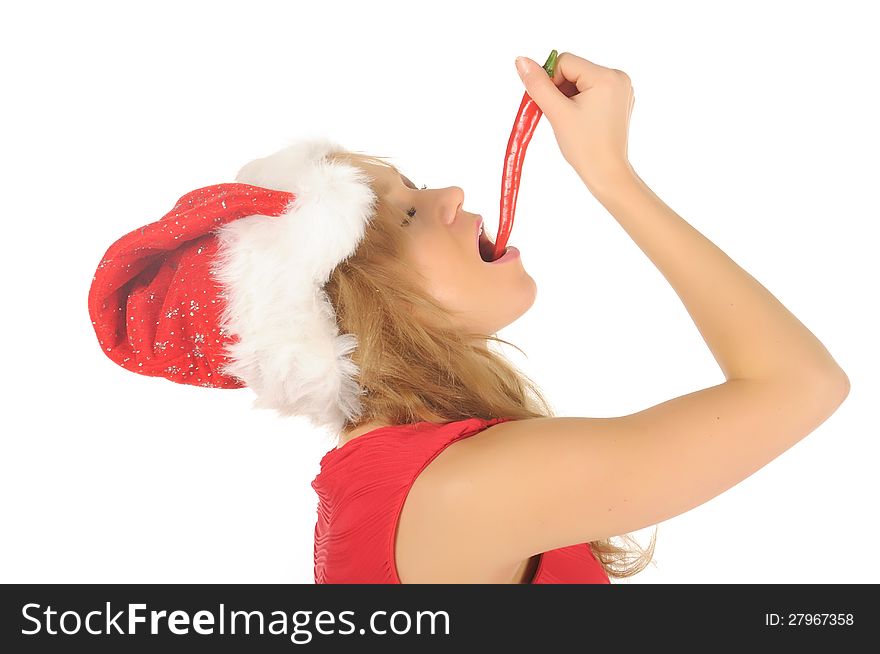 Attractive woman in Santa Cap with chili pepper