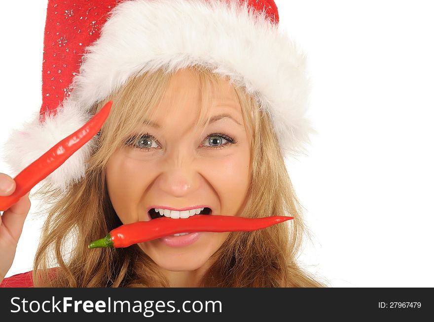 Attractive young woman in Santa Cap with chili pepper. isolated on white. Attractive young woman in Santa Cap with chili pepper. isolated on white.