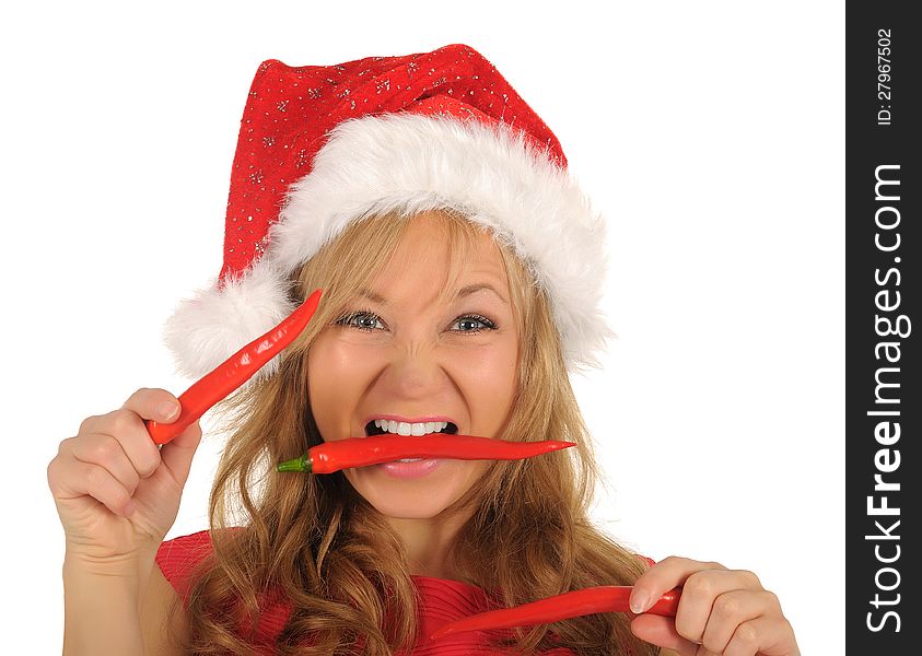 Attractive young woman in Santa Cap with chili pepper. isolated on white. Attractive young woman in Santa Cap with chili pepper. isolated on white.