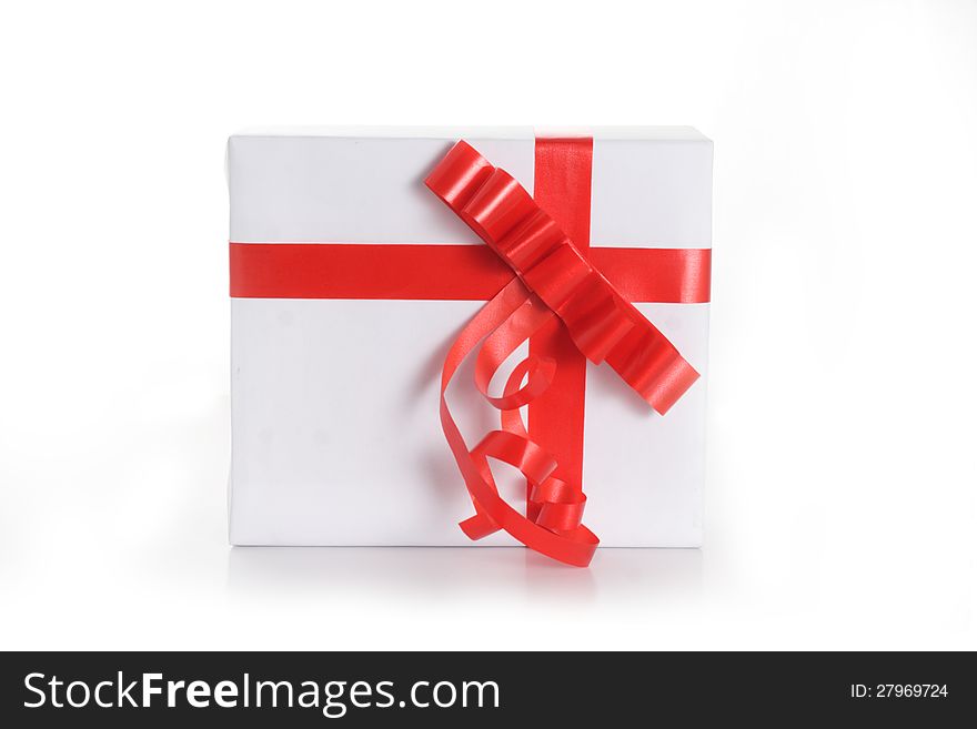 Gift box with red tape on white background