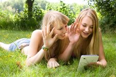 Girls Waving With A Tablet Royalty Free Stock Image Girls Waving With A Tablet Royalty Free Stock Image