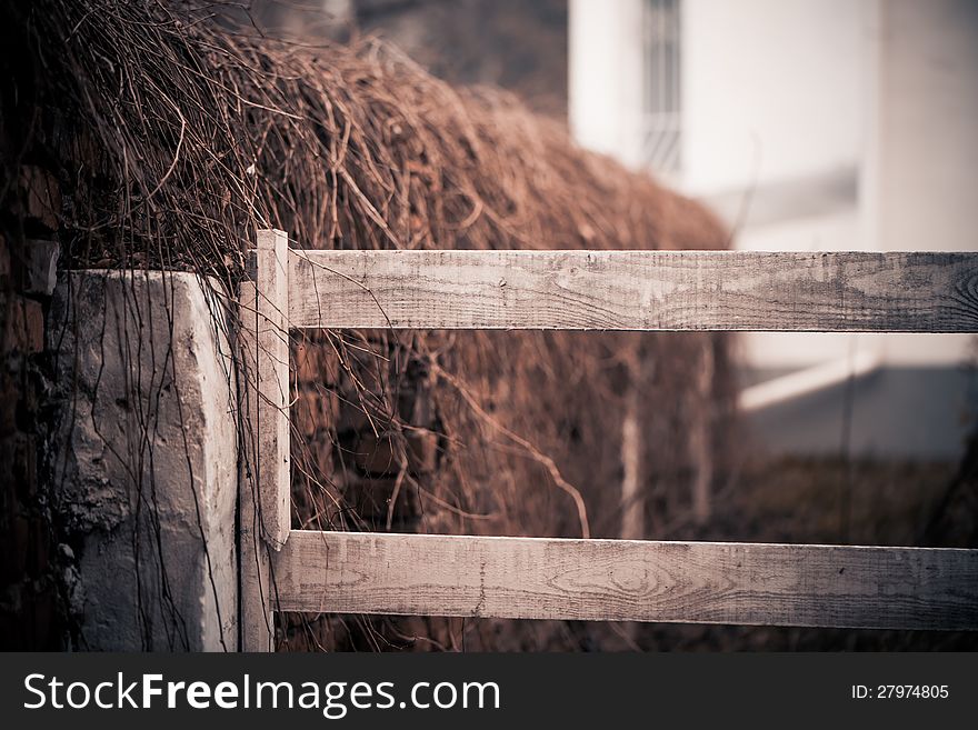 Old brick fence at fall season uptown. Old brick fence at fall season uptown