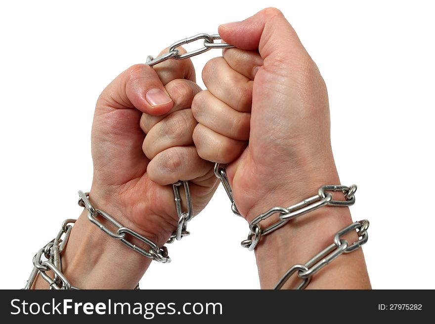 Hands in chains. Hands clenching trying to get free from chains. Hands in chains. Hands clenching trying to get free from chains.