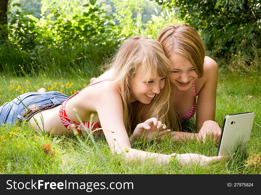 Two girls are having fun in the summer sun. Two girls are having fun in the summer sun