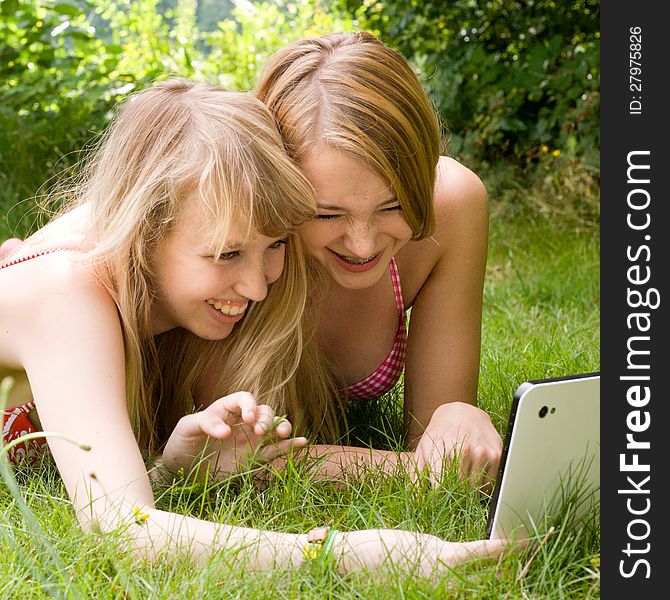 Two girls are having fun in the summer sun. Two girls are having fun in the summer sun