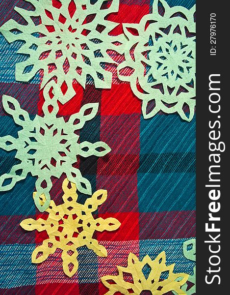 Winter background with handmade paper snowflakes