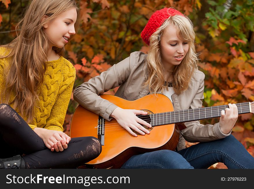 Playing guitar in the forest