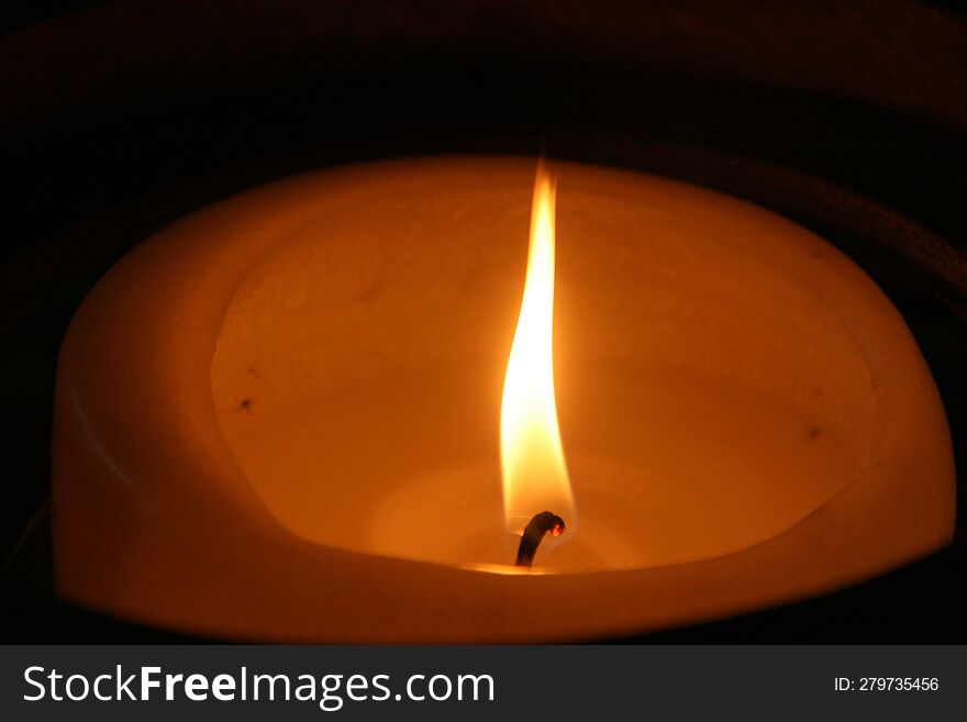 Flame of a burning candle.