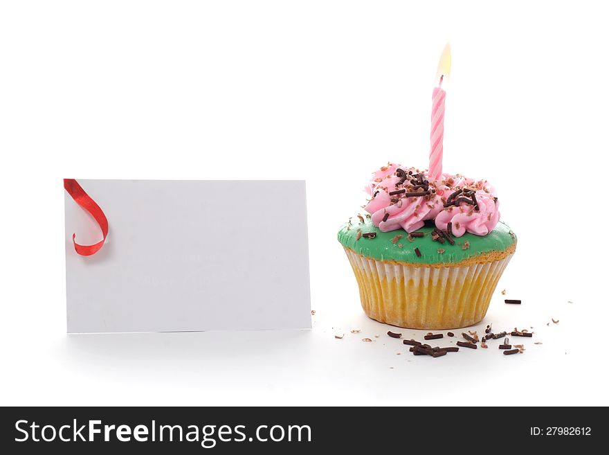 Cup Cake with pink candle & tag, on white background. Cup Cake with pink candle & tag, on white background