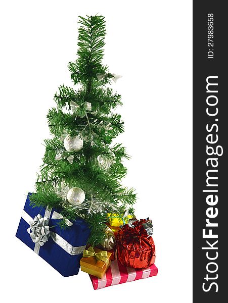 The artificial green conifer with heap of colorful gifts. The artificial green conifer with heap of colorful gifts