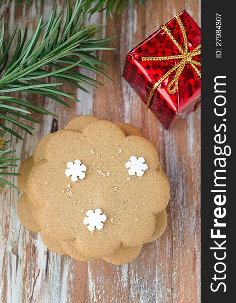 Gingerbread, branch of spruce and gift box, top view. Gingerbread, branch of spruce and gift box, top view