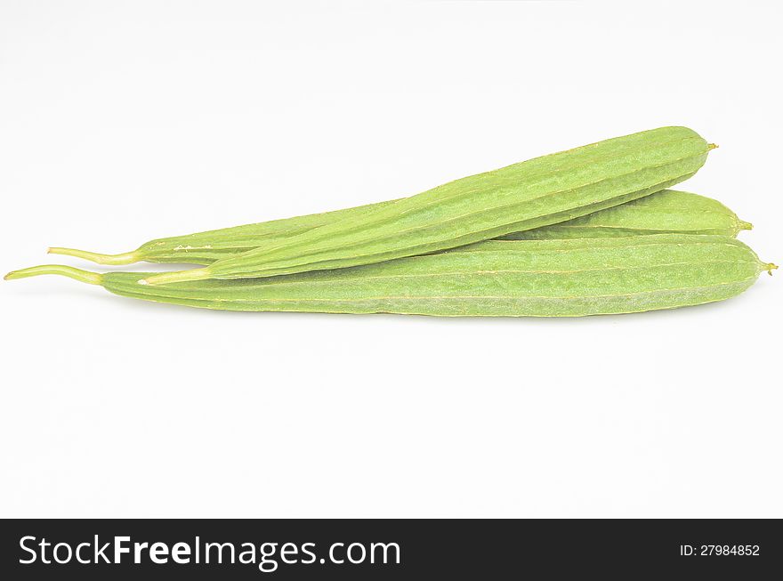 Green vegetable angled gourd in white background