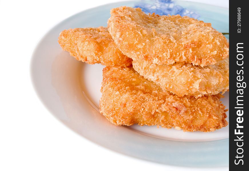 Fish sticks in dish on a white background