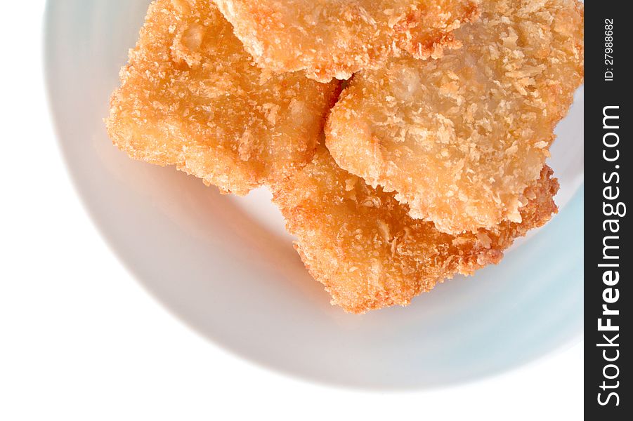 Fish sticks in dish on a white background