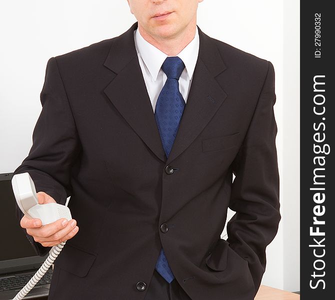 Businessman calling on the phone. Close-up on a white background.