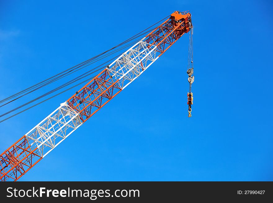 Crane in construction area and blue sky