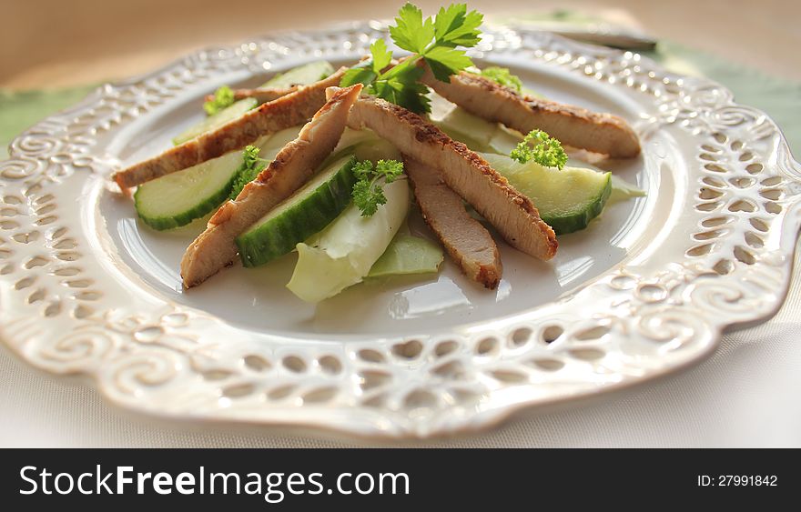 Fresh salad with grilled meat stripes