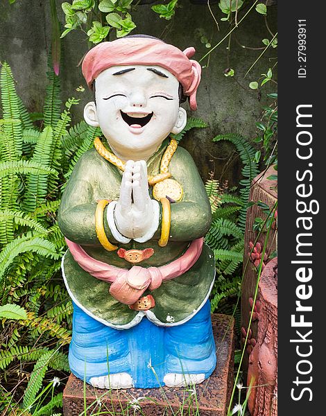 Child sculpture in garden, Phuket, Thailand