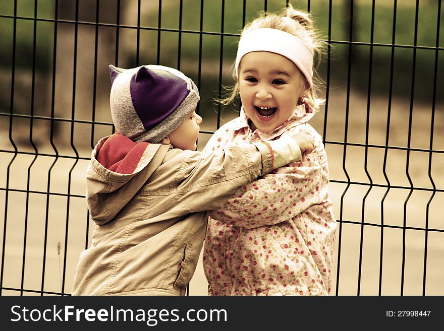Portrait of two little kids. Hugs and smile. Portrait of two little kids. Hugs and smile.