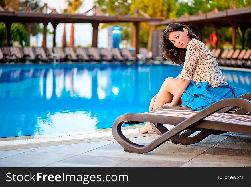 Beautiful young girl at the pool