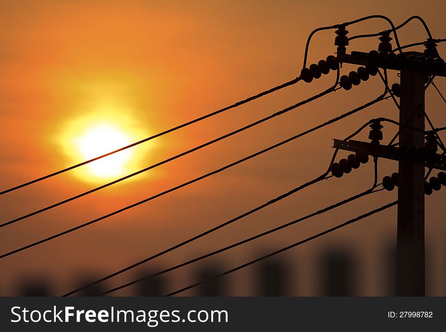 Electricity pylons silhouette at sunset