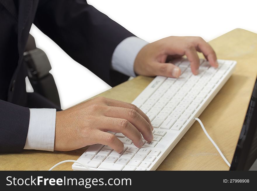 Hand typing computer keyboard in the office