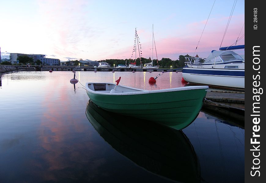 Small boat with sunset view