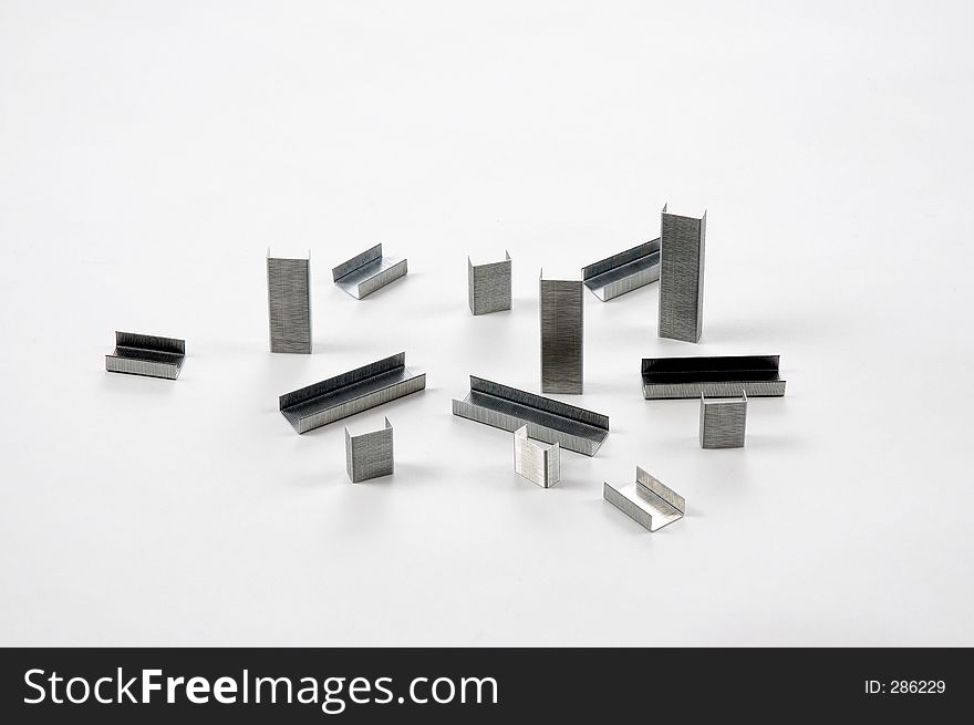Wire staples arranged on awhite background. Wire staples arranged on awhite background