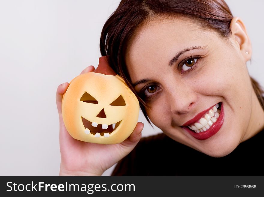 Girl holding a halloween pumpkin. Girl holding a halloween pumpkin