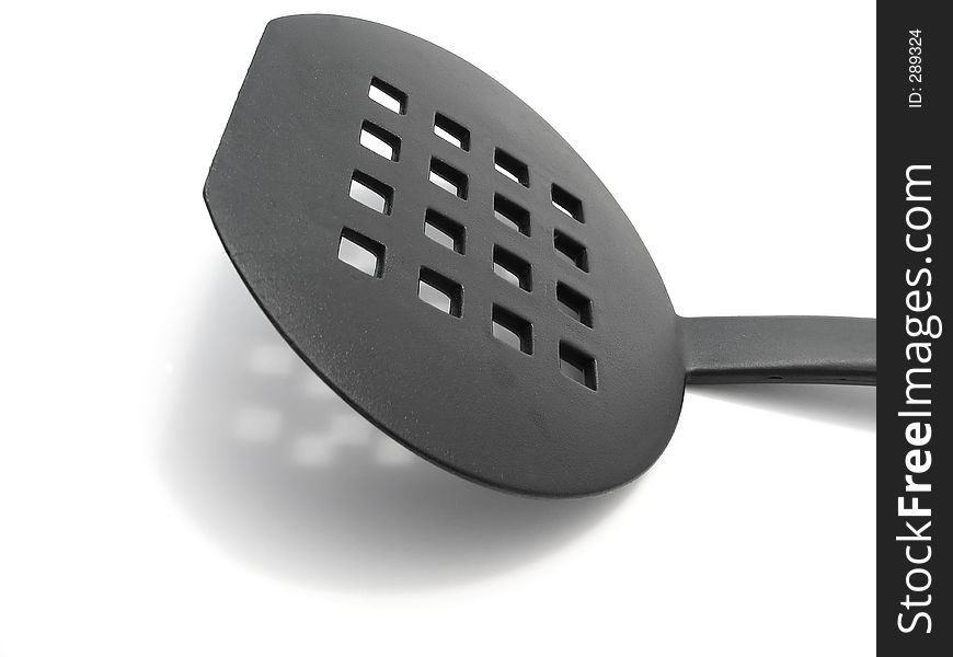 Close-up of a black plastic spatula