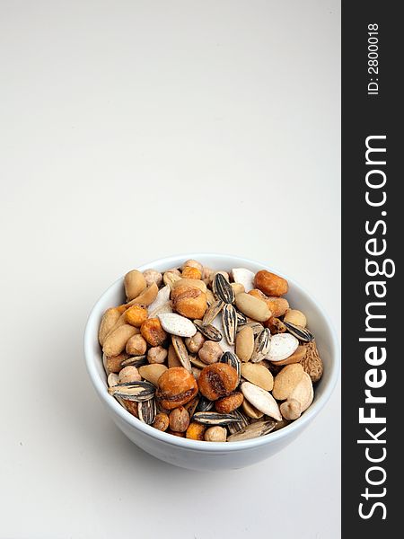 Assortement of nuts on a white bowl. Assortement of nuts on a white bowl