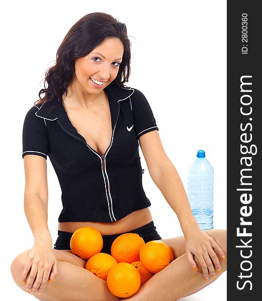 Fitness woman with orange and mineral water