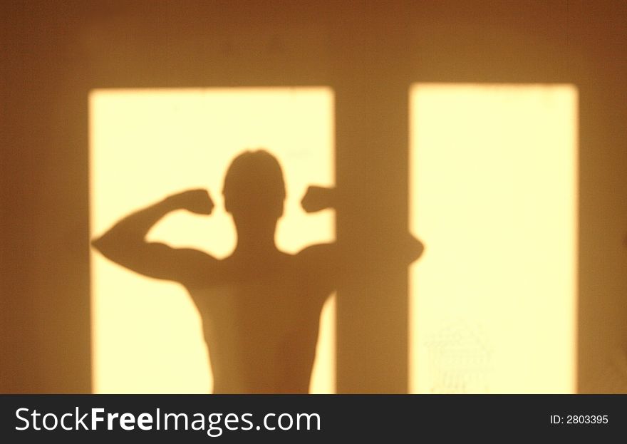 Silhouette of a man doing morning exercises