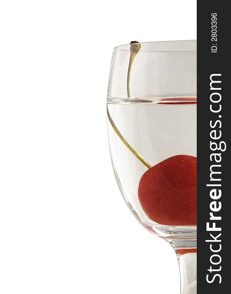 Cherry in glass on white background