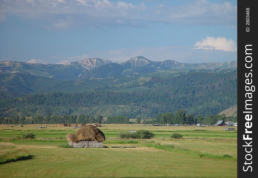 A small earthen hut in a mountain valley. A small earthen hut in a mountain valley.