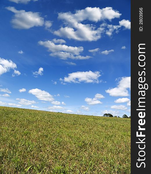 Cloudy sky over a grassy hill. Cloudy sky over a grassy hill