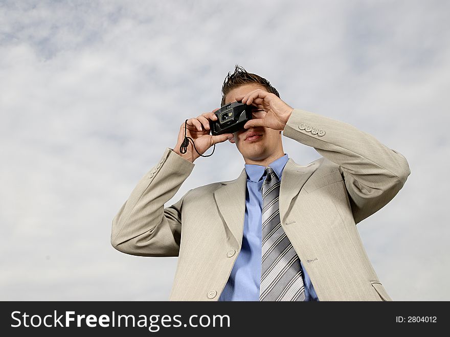 Young Businessman With Camera