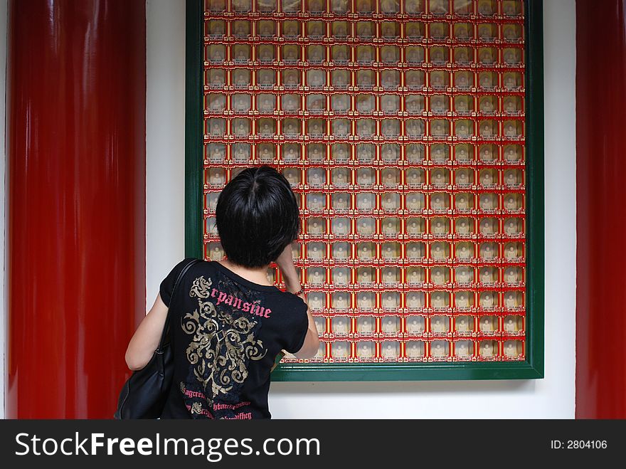 Woman Looking At Buddhas