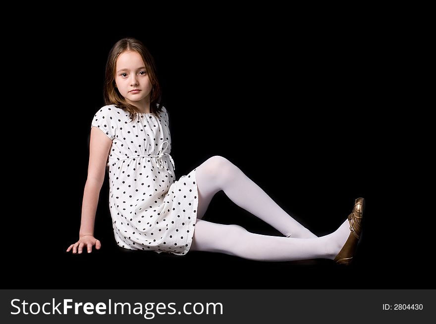 The girl in studio on a black background. The girl in studio on a black background