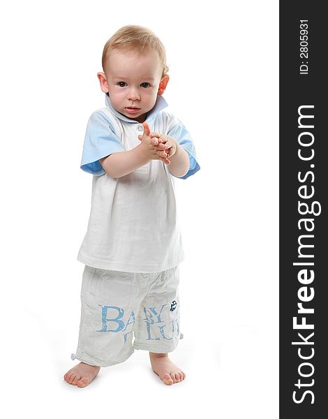 The child claps in a palm on a white background