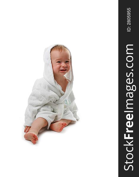 The child in a dressing gown on a white background