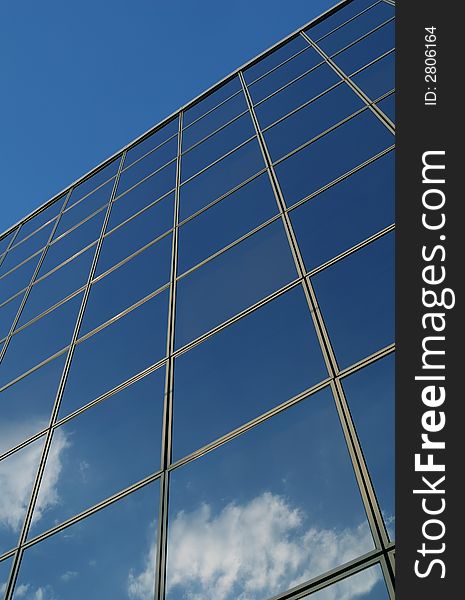 Sky and clouds reflected in glass windows. Sky and clouds reflected in glass windows